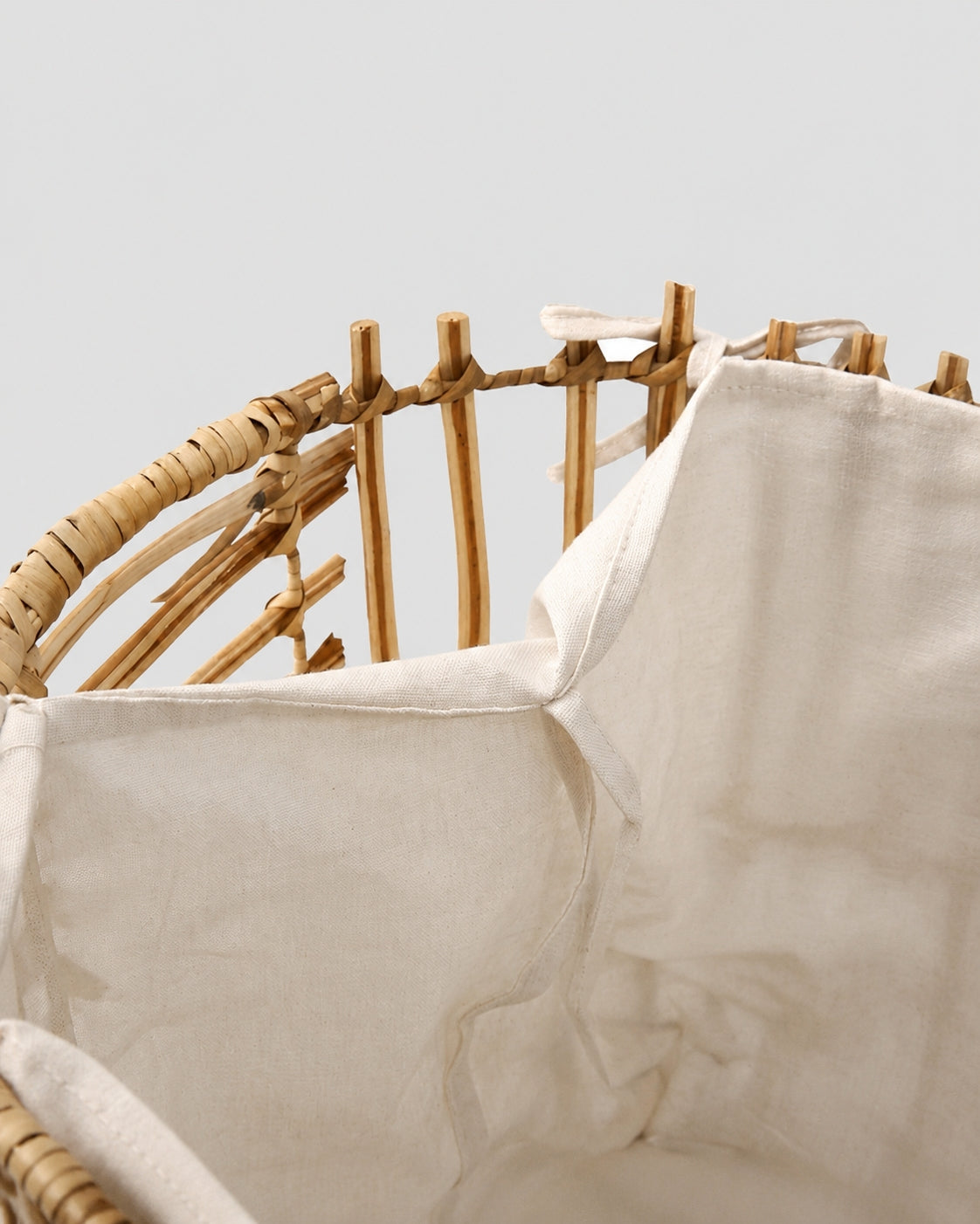 Fabric liner inside faux rattan laundry storage basket