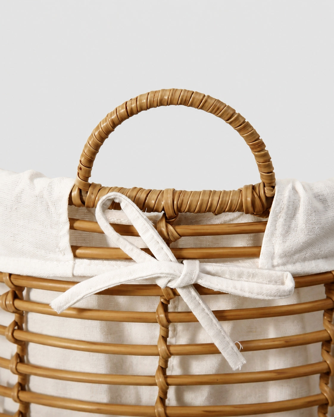 Faux rattan laundry basket handle detail for easy carrying