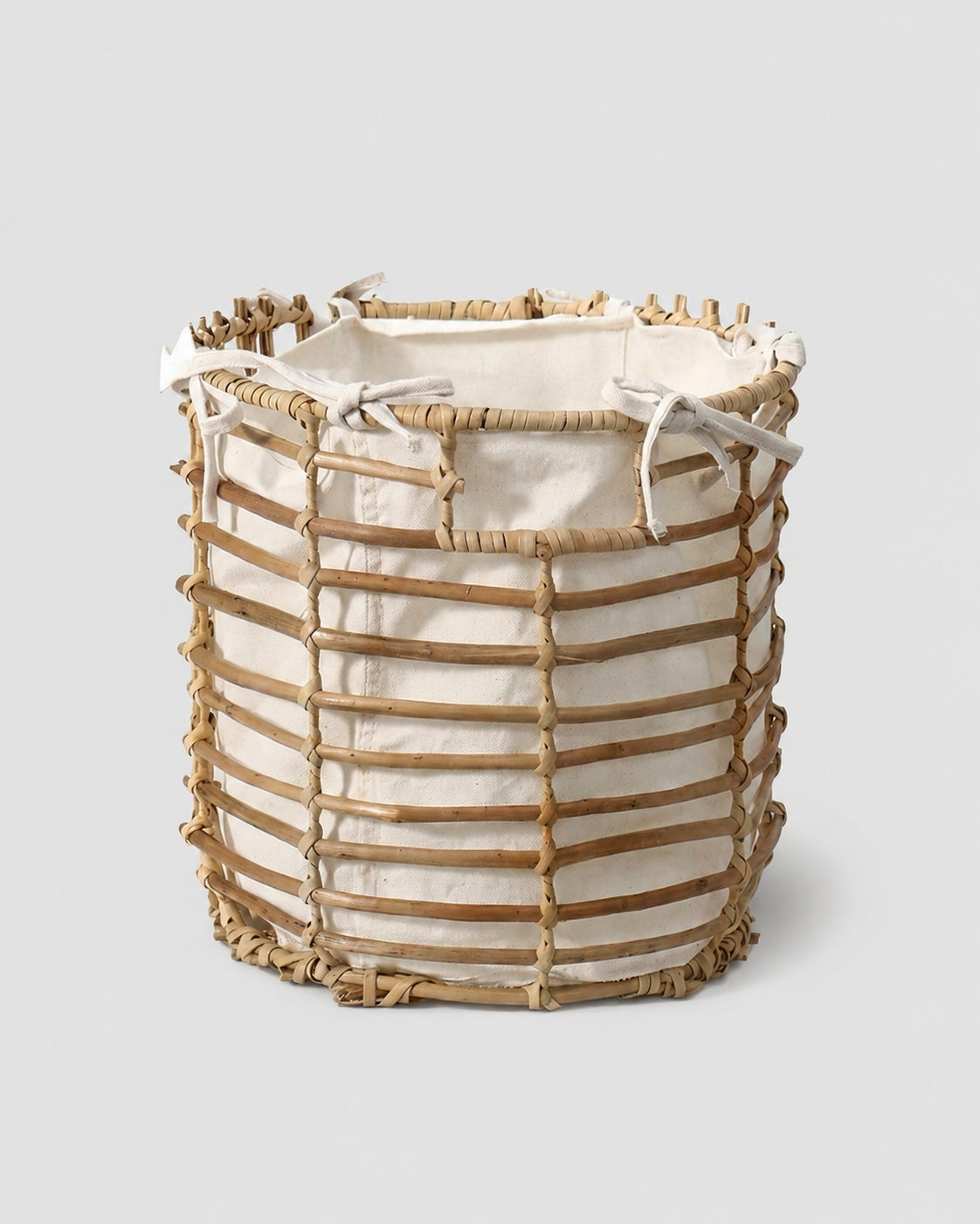 Faux rattan laundry basket with fabric liner for clothes storage