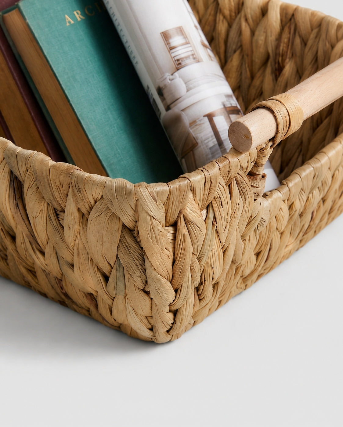 Close up view of handmade woven storage basket texture and handle design