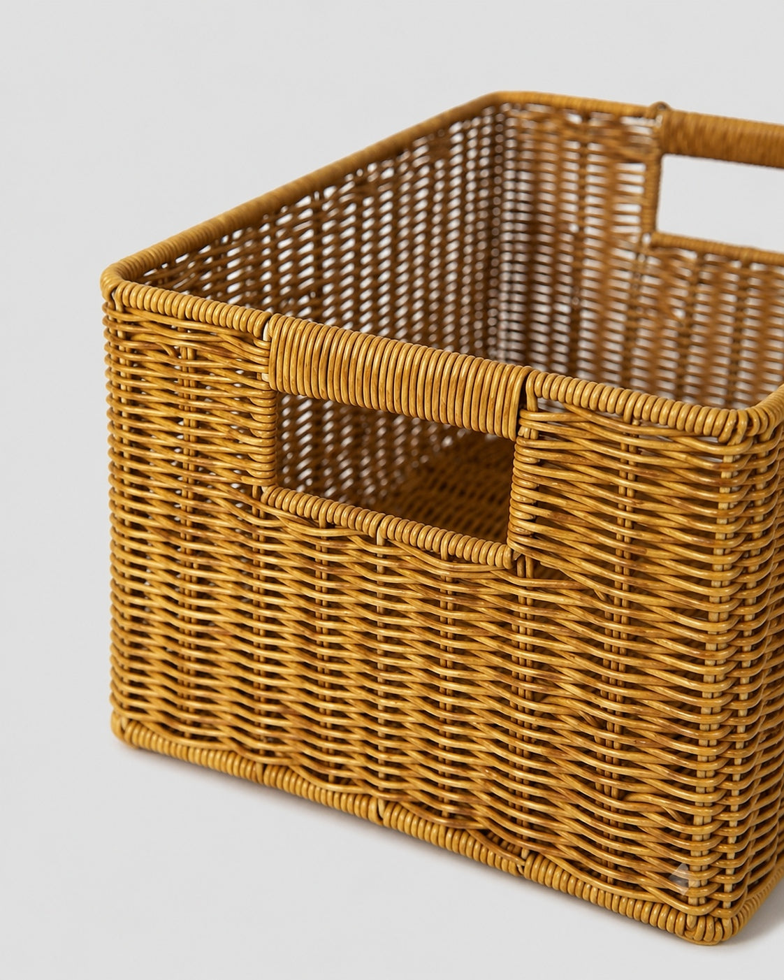 Woven rattan storage box handle detail