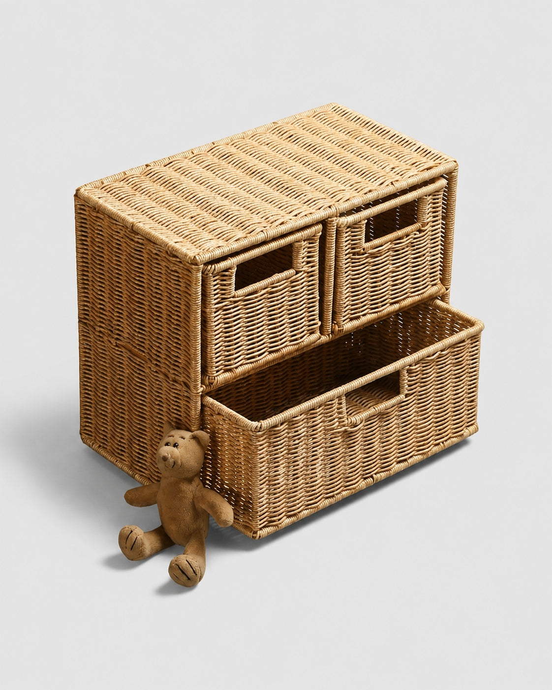 Mikkel faux rattan three-drawer storage cabinet with one lower drawer open