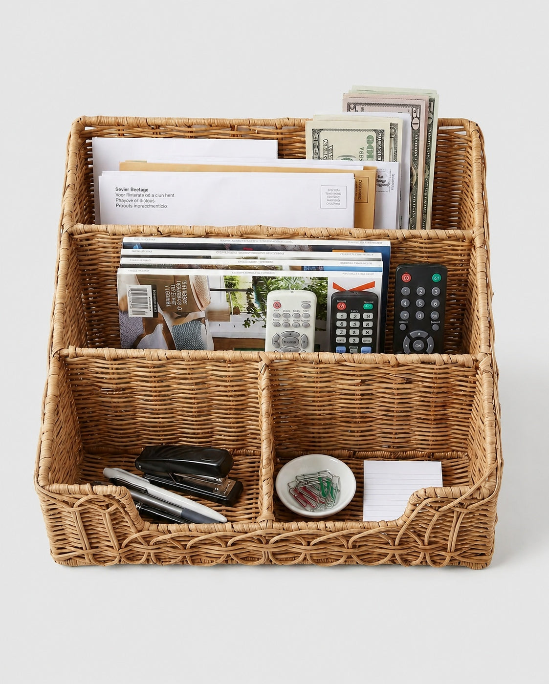 Top view of Solveig faux rattan desk organiser holding letters, magazines, remotes and stationery