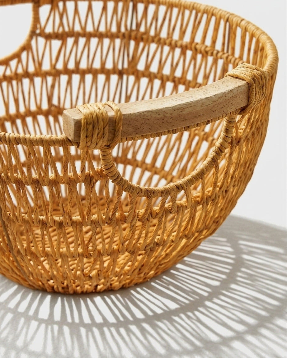 Close-up of Viggo fruit basket’s wrapped faux rattan weave and wooden handle
