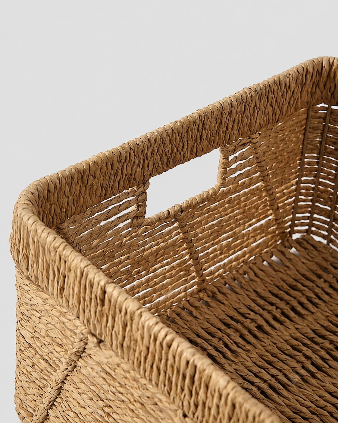 Handmade woven basket with practical handle design