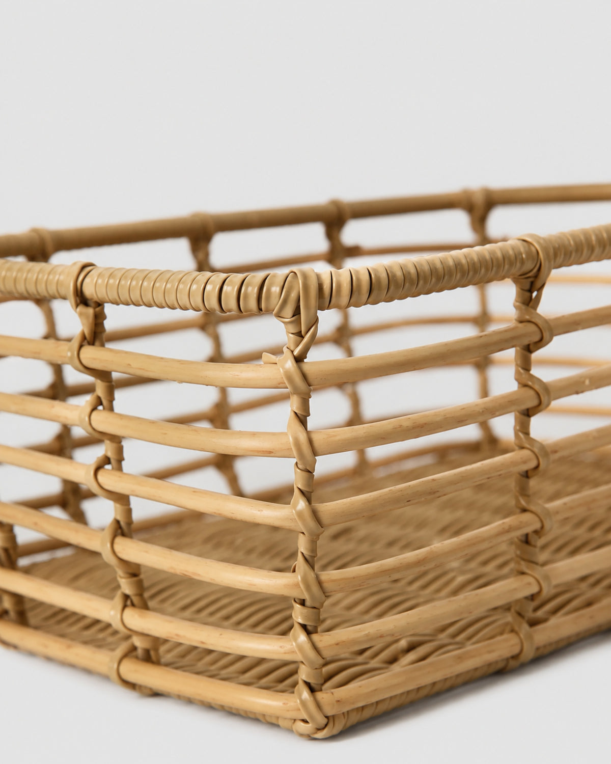 Faux rattan basket with durable woven frame design