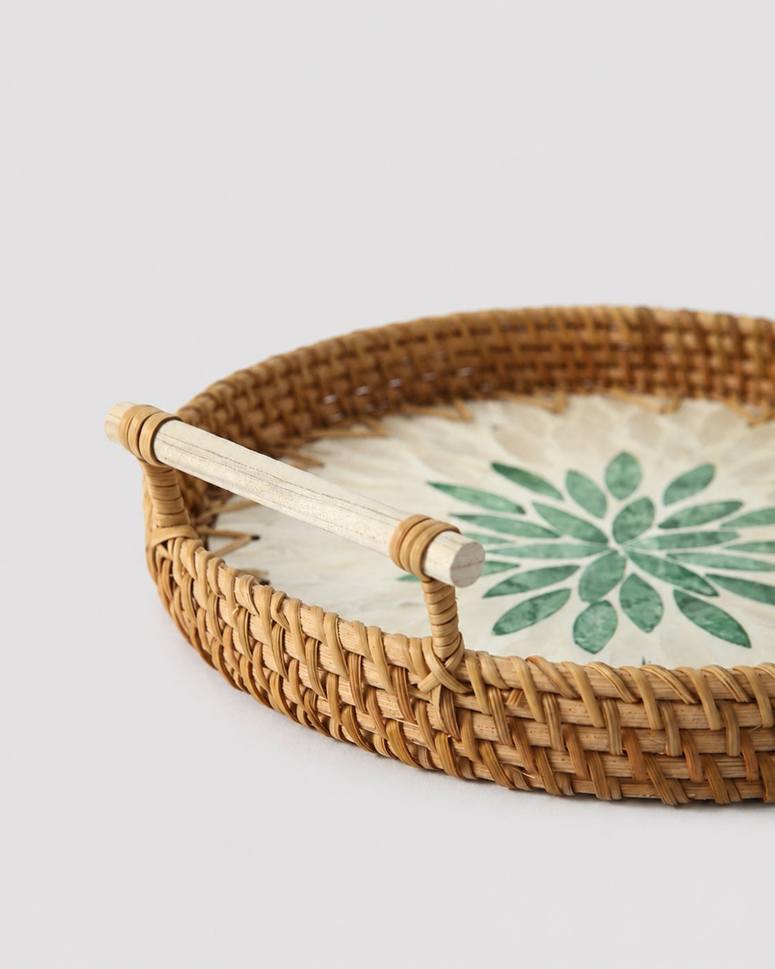 Rattan tray with natural woven handle detail