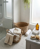 Natural woven basket for bathroom towel storage