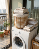 Woven faux rattan hamper for laundry room storage