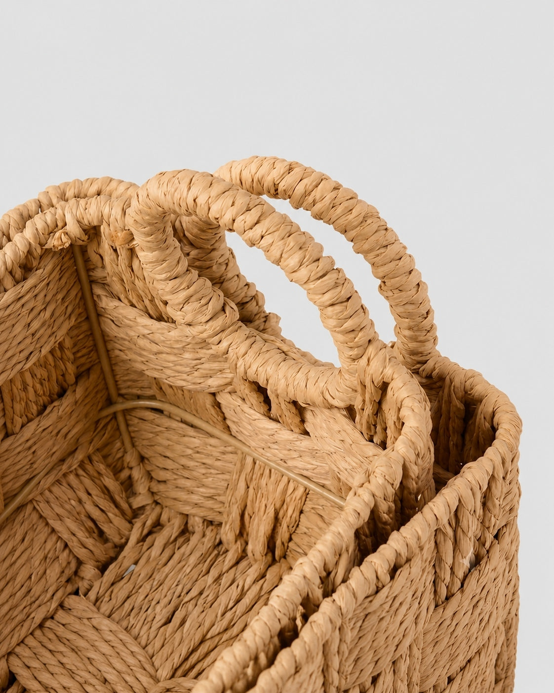 Handmade paper rope storage basket weaving detail with handles