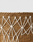 Decorative woven pattern on grass storage basket