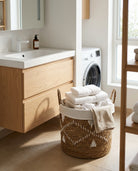 Natural woven basket used for bedroom laundry organization