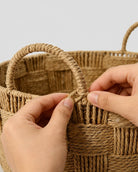Close up view of handwoven paper rope laundry basket texture