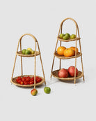 Aina faux rattan fruit trays shown in two-tier and three-tier configurations with fresh fruit