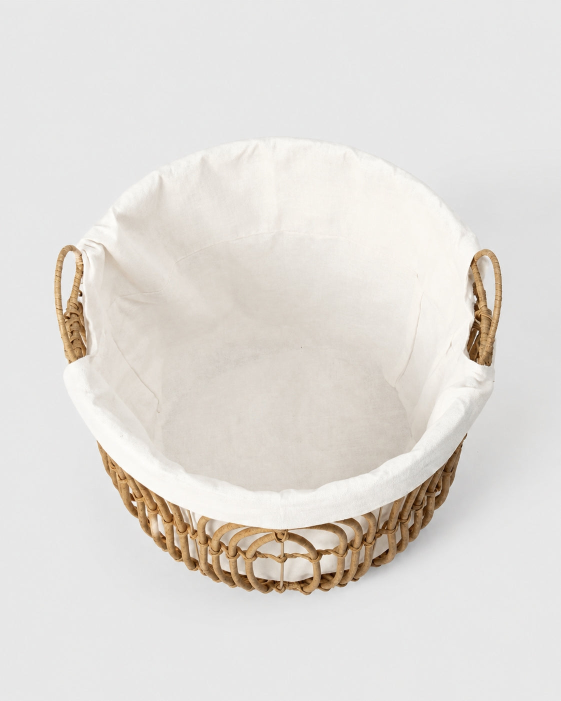 Top view of Aveline faux rattan basket showing its spacious fabric-lined interior