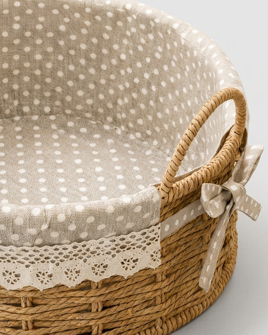 Close-up of Bodil basket’s beige polka-dot lining, woven handle, lace trim and bow