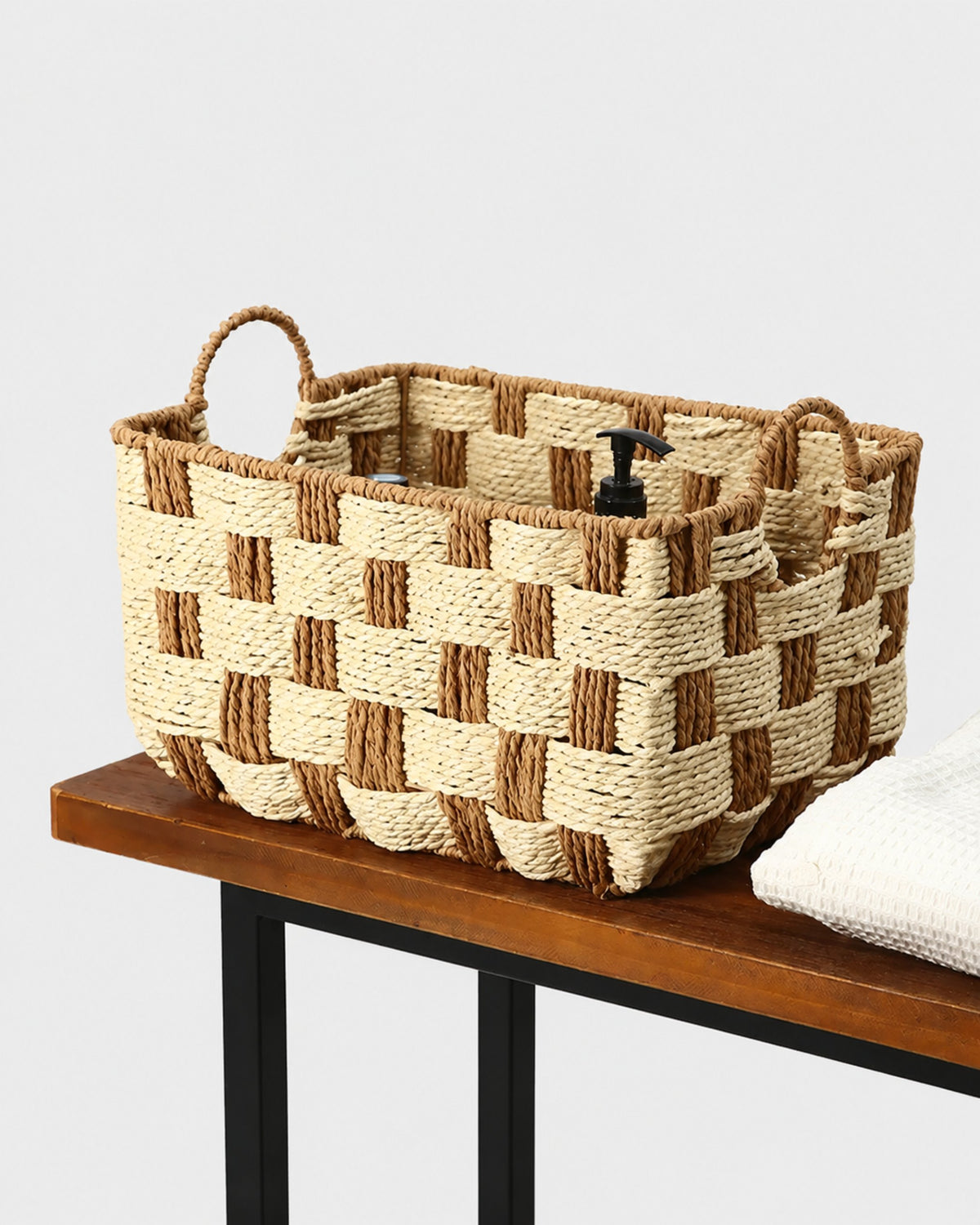 Elsa paper rope storage basket holding everyday items on a wooden table