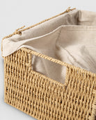 Close-up of Elva storage box’s off-white fabric liner and woven paper rope side handle opening
