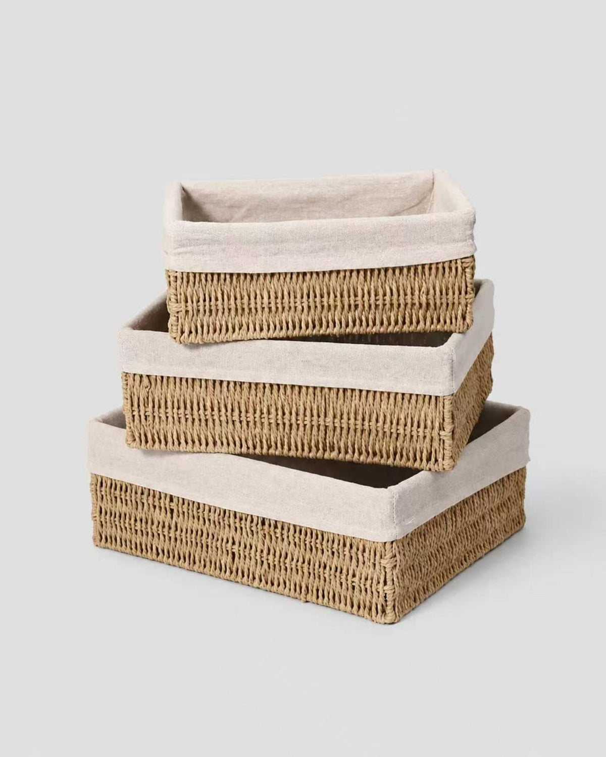 Liv paper rope vanity storage baskets stacked in Small, Medium and Large sizes