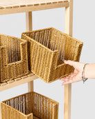 Mila faux rattan open-front snack baskets arranged on a wooden storage shelf