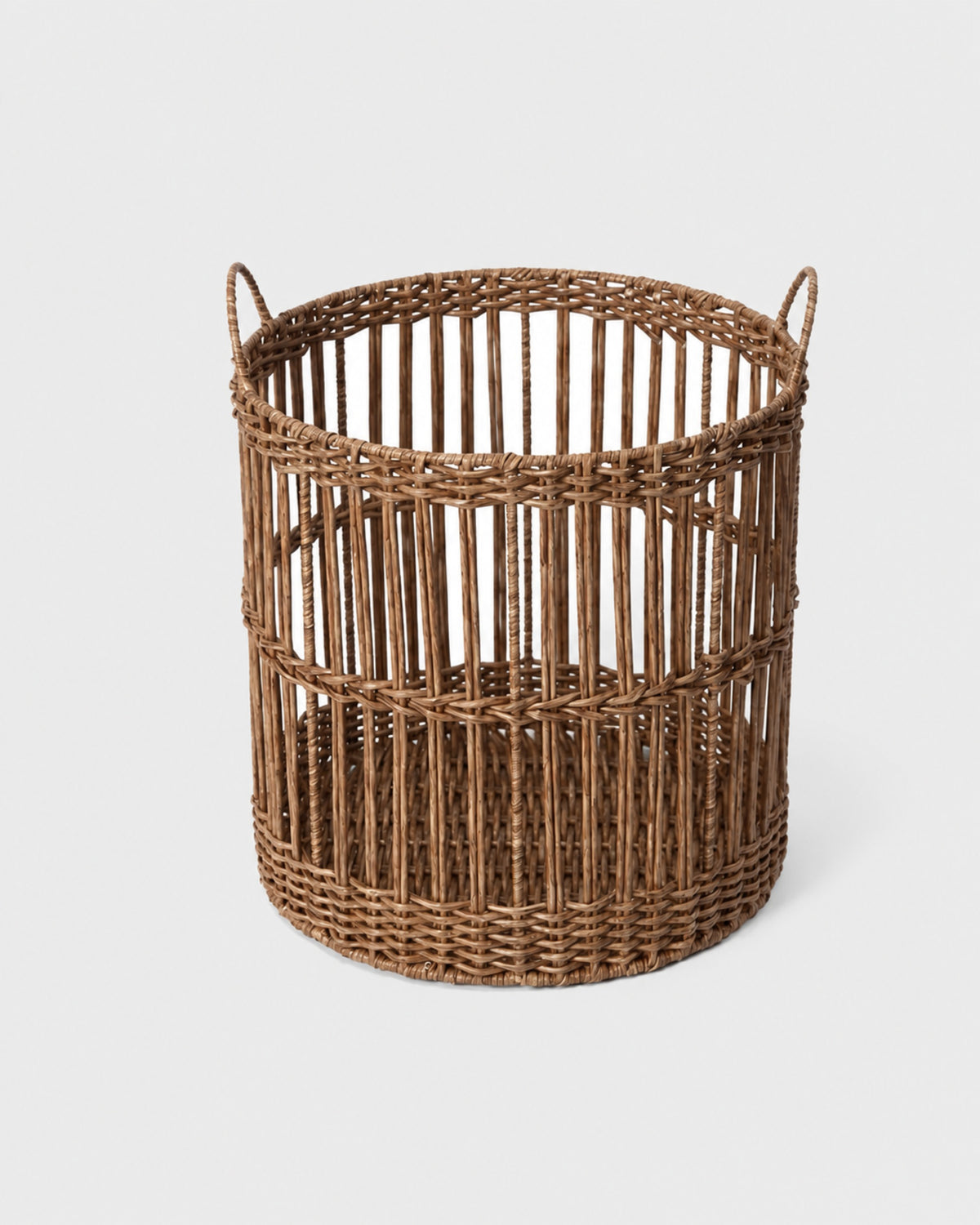 Nora round faux rattan laundry basket showing its open vertical woven structure