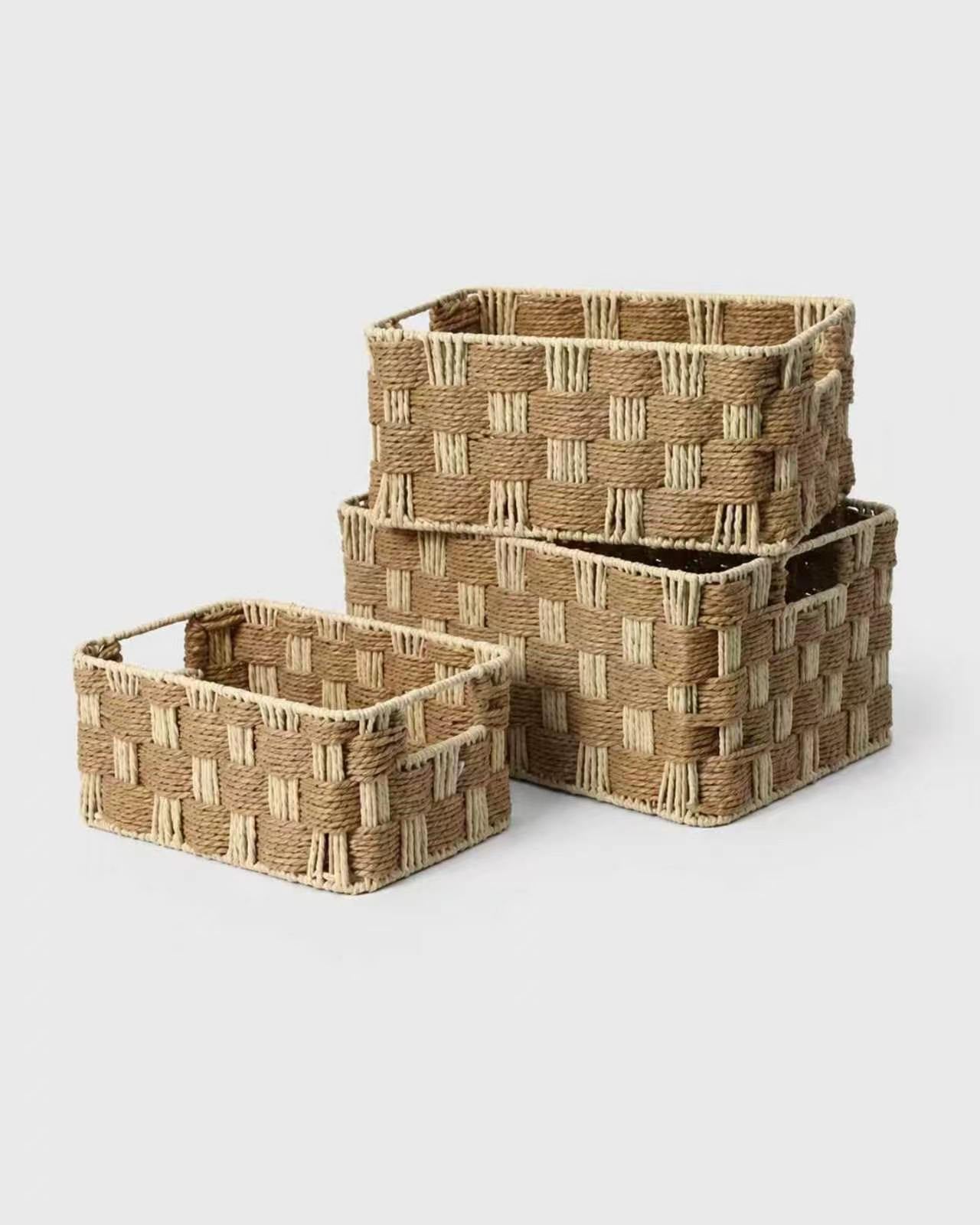 Three Siv handwoven paper rope makeup baskets in natural beige and light tan block weave