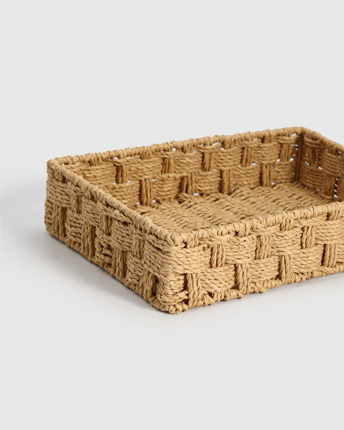 Close-up of the open rectangular Tilda paper rope cosmetic storage basket