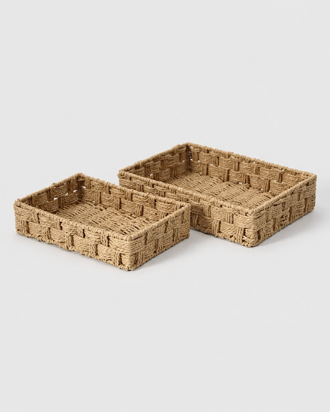 Two Tilda paper rope cosmetic storage baskets in natural handwoven paper rope