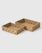 Two Tilda paper rope cosmetic storage baskets in natural handwoven paper rope