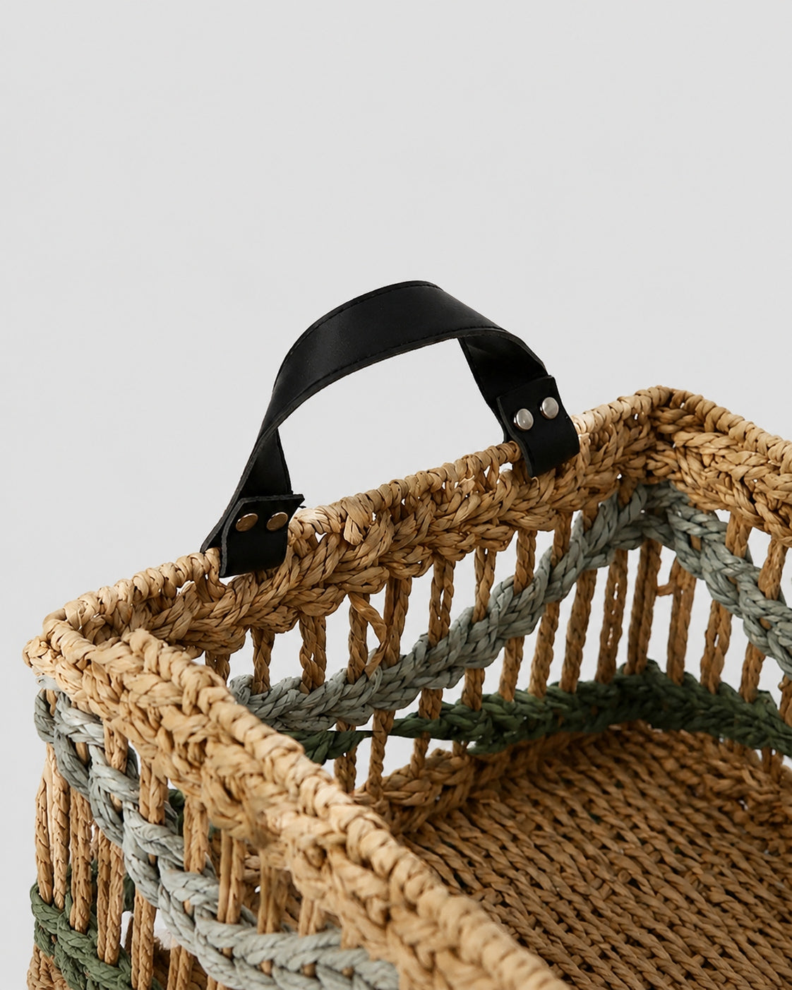 Close up view of woven storage basket handle design