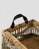 Close up view of woven storage basket handle design