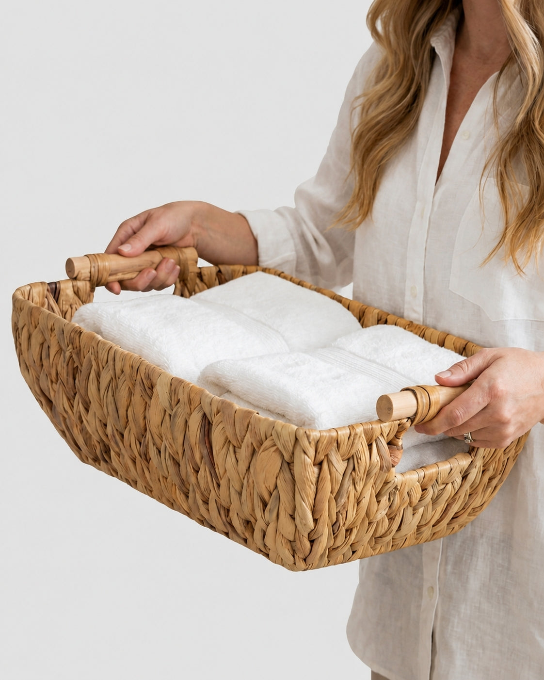 Natural woven basket with handles for towels and bathroom essentials storage