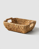 Woven grass storage basket with handles for bathroom and bedroom organisation