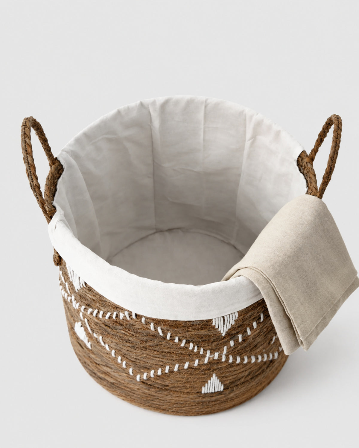 Natural woven laundry basket with soft fabric inner lining