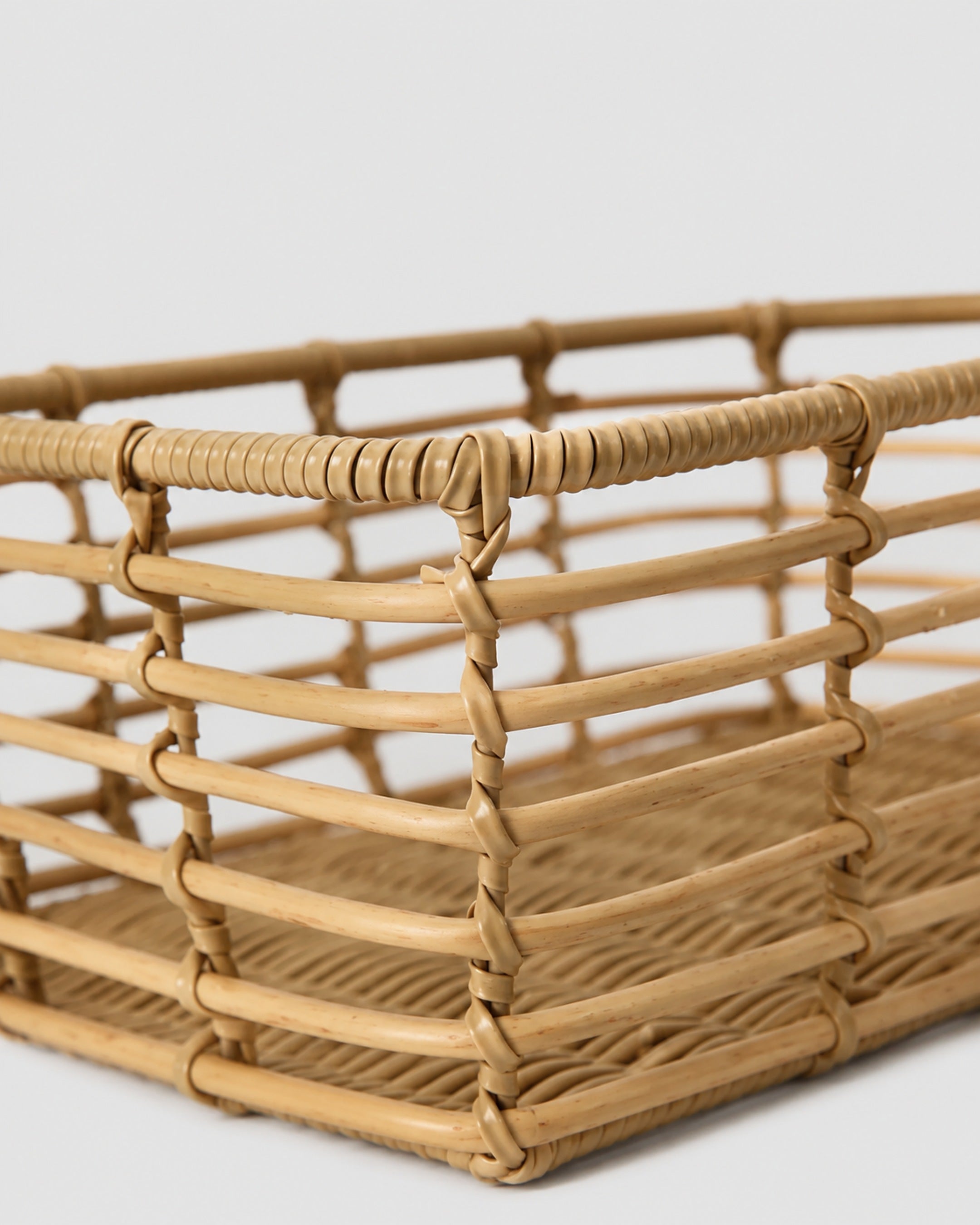 Faux rattan basket with durable woven frame design